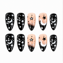 Ten black and nude almond nails with white crescent moons stars and silver speckles on white