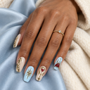 Pale blue cream and gold scroll square press-on nails – model wearing nails over pale blue silk