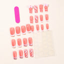 Supplier view of coral pink French bow nails with glitter swirls and white cuticle dots