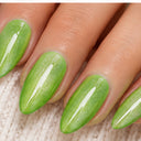 Green shimmer almond press-on nails worn on hand