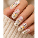 Ivory wildflower coffin press-on nails worn on hand