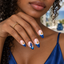 Navy ocean whale shark and gold star almond press-on nails — worn on hand