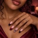 Red and black spider French square press-on nails — worn on hand