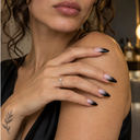 Blush nude to black ombré pointed almond press-on nails — worn on hand