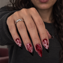 Burgundy drip and splatter black French pointed nails – hand