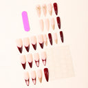 Burgundy and gold French pointed nails with bow pearl and star accents – supplier
