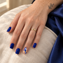 Blue gold marble square nails worn with a gold ring