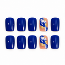 Royal blue square nails with nude blue-white marble and gold foil accents