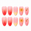 Coral pink sculpted shell yellow floral and pearl almond nails – hero