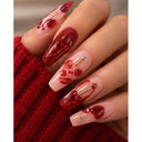 Red and nude abstract almond press-on nails worn on hand