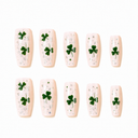 Ten green shamrock and silver flake long square nails on white