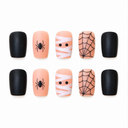 Ten peach and black short square nails with mummy, spider and web artwork