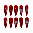 Wine red white spiderweb stiletto nails — hero