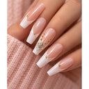 Nude French crystal coffin press-on nails worn on hand