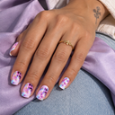 Pastel pink aqua and purple gold marble square press-on nails – model wearing nails over lilac silk and denim
