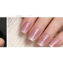 Pearl pink shimmer square press-on nails worn on hand