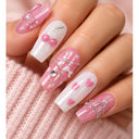 Pink cherry rhinestone square press-on nails worn on hand