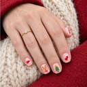 Pink Christmas icons short square press-on nails – model wearing nails with red wool and cream knit