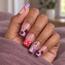 Pink and lilac floral polka dot square press-on nails worn on hand