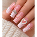 Pink white floral square press-on nails worn on hand