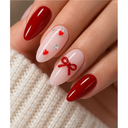 Red heart bow almond press-on nails worn on hand