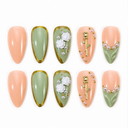 Ten sage green and peach almond nails with white roses, pearls and gold details on white